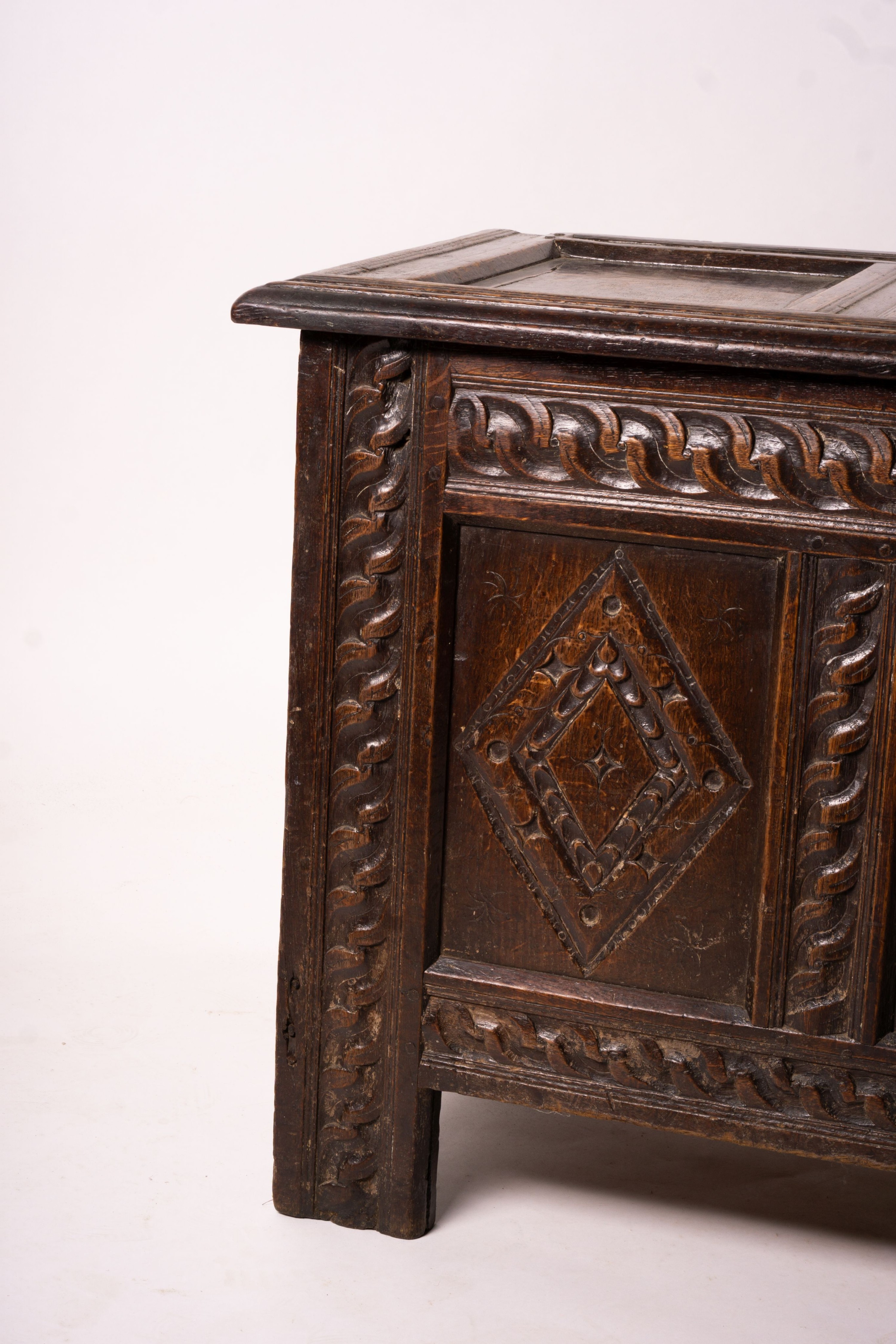 A 17th century carved panelled oak coffer, length 115cm, depth 56cm, height 67cm